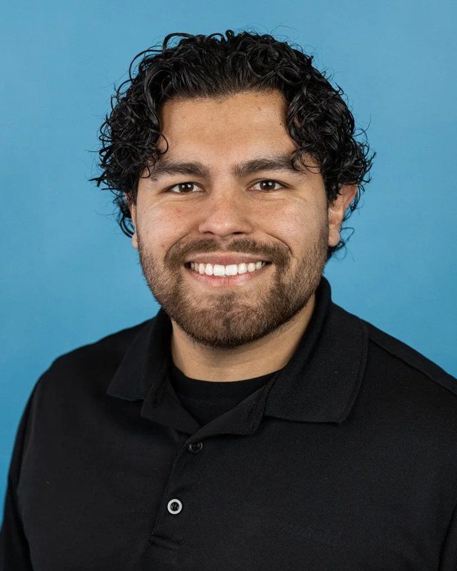 Team headshot, team day, blue backdrop